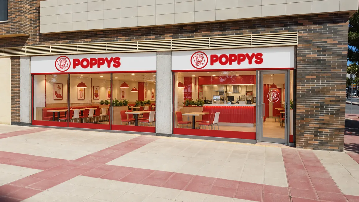 Concepto POPPYS sobre foto de una fachada en Murcia